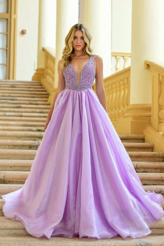 The Ava Presley 38342 A Line Beaded V Neck Ballgown is the perfect choice for your next pageant, prom, or formal event. With stunning beaded detailing and a flattering A line silhouette, this gown will turn heads and make you feel like a true queen. The V neck adds an elegant touch, while the train adds a touch of drama. Make a statement with this gorgeous dress.  Sizes: 00-16  Colors: Lilac, White, Ice Blue, Periwinkle
