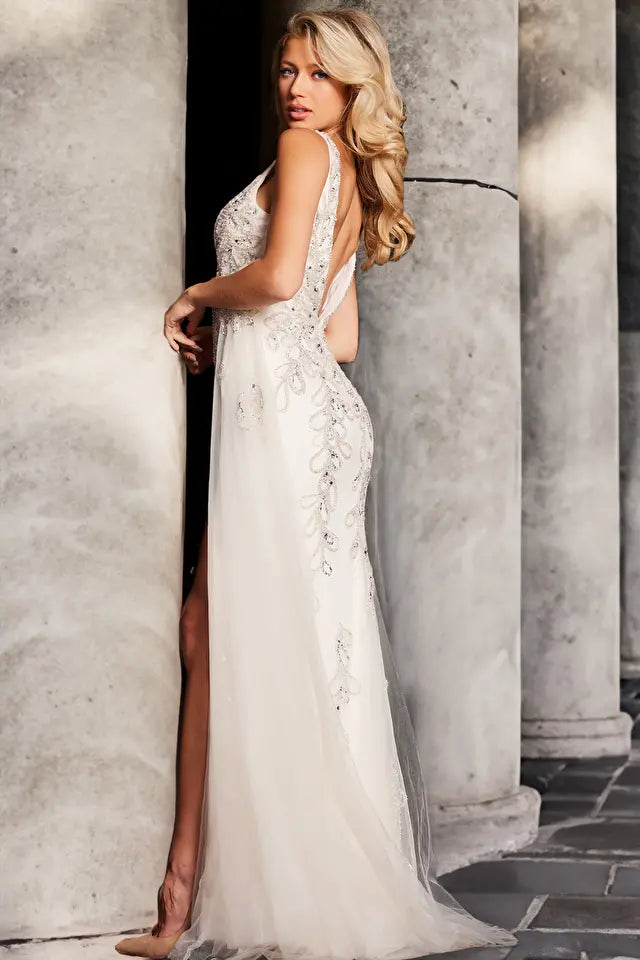 Elevate your formal look with the Jovani 39105 prom dress, a captivating and versatile gown suitable for proms, weddings, and other formal events. Crafted from luxurious beaded mesh, this fitted dress is designed to highlight your figure. It features a daring high slit and a graceful long side tail, adding a touch of drama and elegance.
