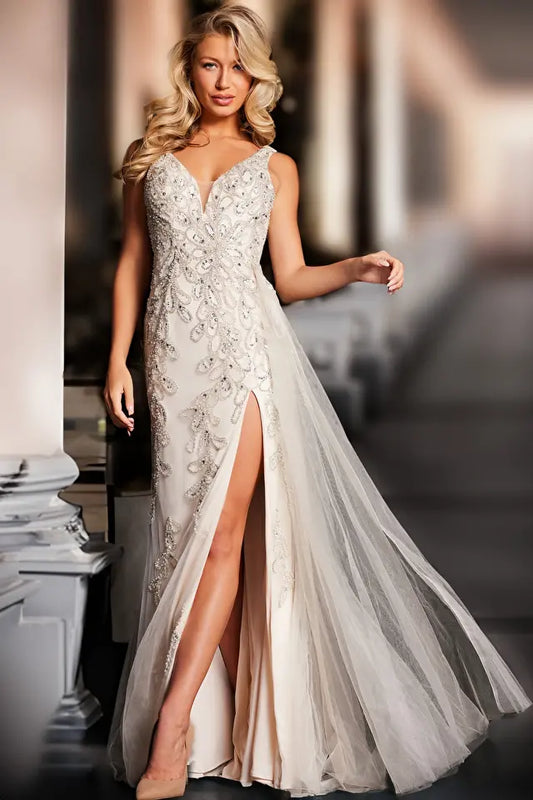 Elevate your formal look with the Jovani 39105 prom dress, a captivating and versatile gown suitable for proms, weddings, and other formal events. Crafted from luxurious beaded mesh, this fitted dress is designed to highlight your figure. It features a daring high slit and a graceful long side tail, adding a touch of drama and elegance.