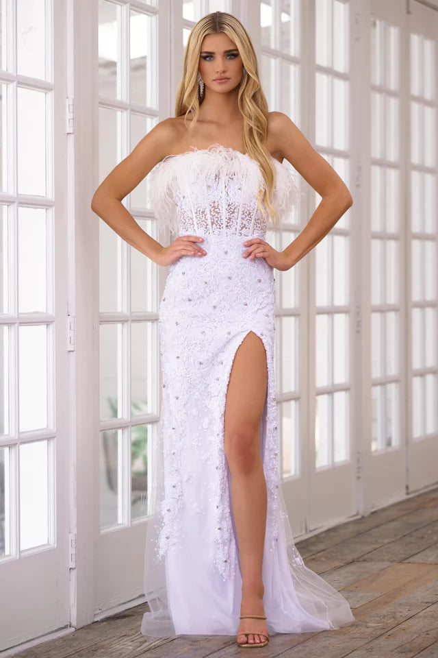 Elevate your formalwear with the Ava Presley 39231 Long Prom Dress. The strapless corset bodice and high slit skirt offer a flattering silhouette, while the delicate beading and feather details provide a touch of elegance. Perfect for pageants and formal events.