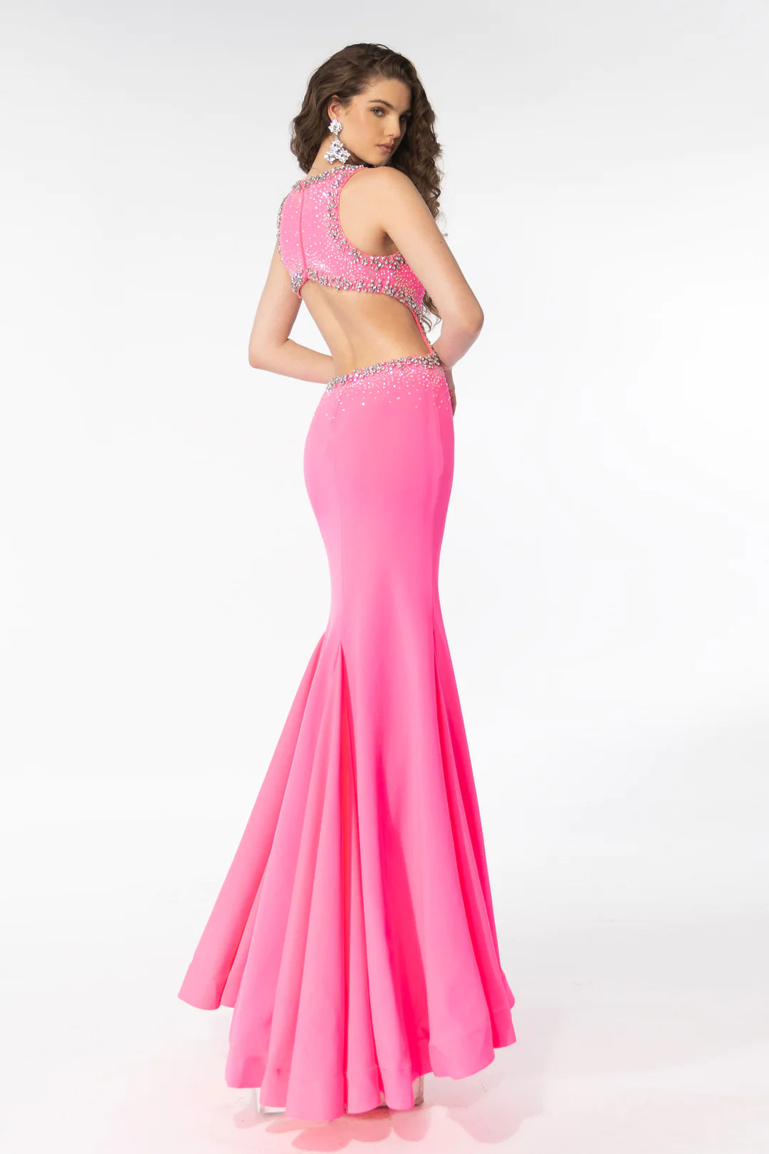 Elevate your prom look with the Ava Presley 39237 Long Prom Dress. The open back, cut out design, and high slit adds a touch of drama while the beaded detailing gives it a glamorous touch. Perfect for formal events and pageants.