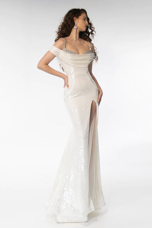 Elevate your formal attire with the Ava Presley 39258 Long Gown. Adorned with sparkling sequins and rhinestone details, this gown features a cowl neckline and shoulder straps for a captivating look. Perfect for prom or pageants, this gown is sure to make a statement. Expertly designed for an unforgettable experience.