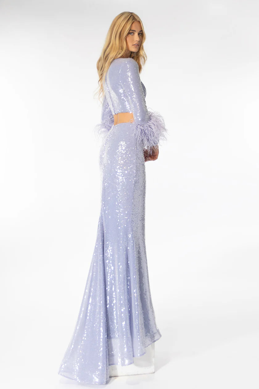 Be the star of the show with the Ava Presley 39259 Long Prom Dress. The long sleeves, sequin detail, and feather cuff on the bodice make for a stunning formal pageant gown. Don't miss out on the perfect balance of elegance and glamour for your next event.