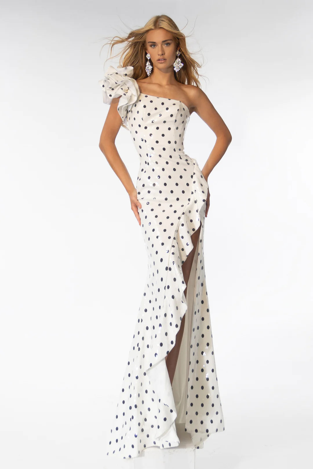 Step onto the red carpet in style with the Ava Presley 39264 Sequin Polka Dot Fitted One Shoulder Long Dress. This stunning gown features a unique one shoulder design and a fitted silhouette adorned with shimmering sequin polka dots. Perfect for prom, formal events, or pageants, this dress guarantees a show-stopping entrance.