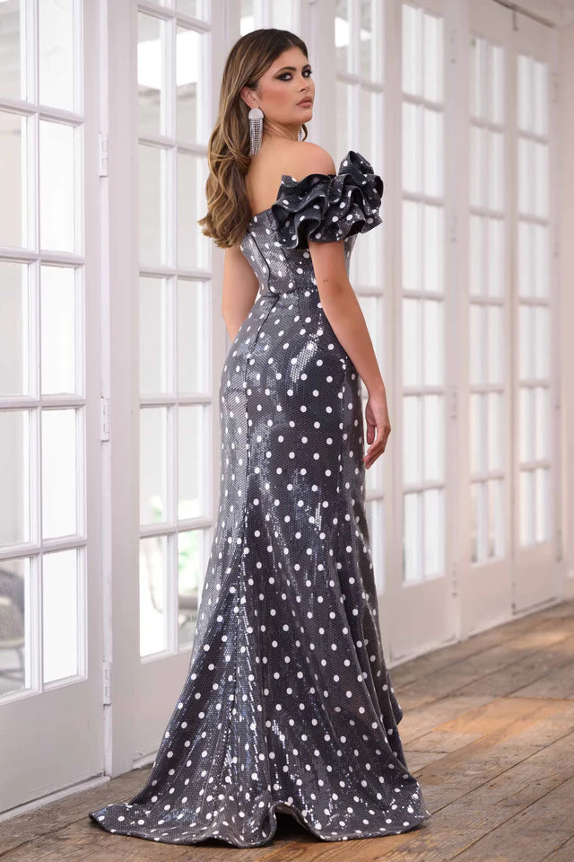 Step onto the red carpet in style with the Ava Presley 39264 Sequin Polka Dot Fitted One Shoulder Long Dress. This stunning gown features a unique one shoulder design and a fitted silhouette adorned with shimmering sequin polka dots. Perfect for prom, formal events, or pageants, this dress guarantees a show-stopping entrance.