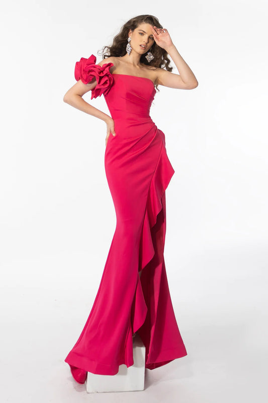 Expertly crafted, the Ava Presley Prom Dress boasts a fitted mermaid silhouette, a flattering one shoulder design, and a high ruffle slit. The strapless bodice is adorned with a beautiful bow, adding a touch of elegance. Perfect for any formal occasion, this gown guarantees a glamorous and sophisticated look.
