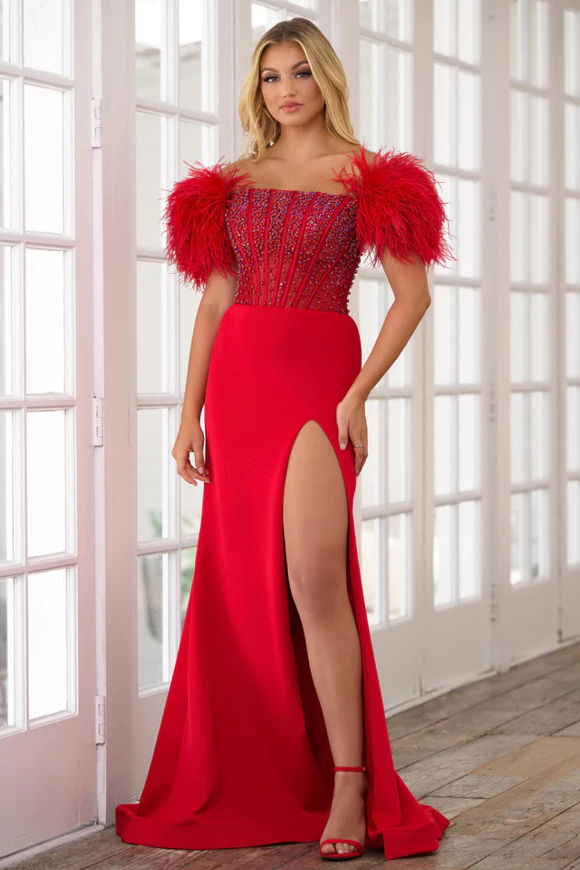 Experience the ultimate elegance in the Ava Presley 39279 Long Prom Dress. The off-shoulder feather gown is enhanced by a sheer corset bodice, perfect for formal events and pageants. Channel your inner beauty with this luxurious and show-stopping piece.