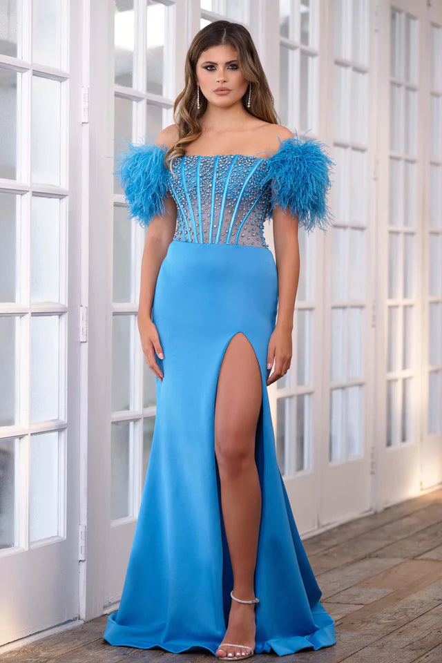 Experience the ultimate elegance in the Ava Presley 39279 Long Prom Dress. The off-shoulder feather gown is enhanced by a sheer corset bodice, perfect for formal events and pageants. Channel your inner beauty with this luxurious and show-stopping piece.