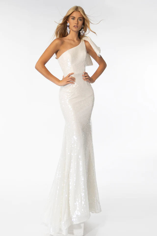 Expertly crafted for elegant occasions, the Ava Presley 39286 Long Sequin Gown presents a captivating silhouette and stylish one shoulder bow detail. Dazzling sequins and a mermaid train add dramatic flair, making it the perfect choice for proms, formal events, and more.