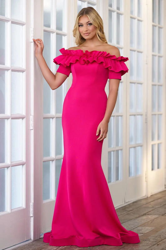 Expertly crafted for alluring elegance, the Ava Presley 39305 Long Evening Gown is designed with heavy jersey fabric and delicate ruffle detailing. Its off-the-shoulder neckline adds a touch of glamour, perfect for prom or formal pageants. Bring out your inner goddess with this stunning gown.