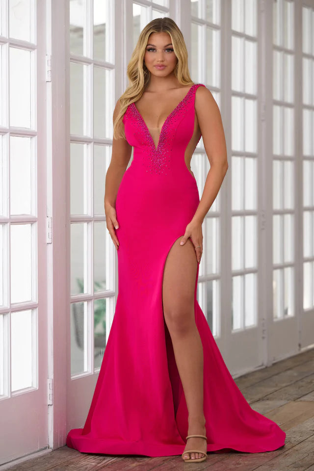 Get ready to turn heads in the stunning Ava Presley 39550 Long Prom Dress. Designed with a fitted silhouette and plunging V-neckline, this dress is both sultry and elegant. The high slit adds a touch of drama, while the beaded detailing adds sparkle and sophistication. Perfect for prom, pageants, or any formal event.