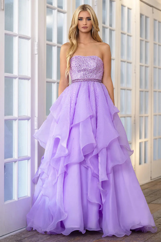 Add a touch of elegance to any formal event with the Ava Presley 39561 Long Prom Dress. The beaded bodice and halter top provide a dazzling look, while the crystal belt-line and layered ruffles add texture and movement. Perfect for prom, pageants, or any special occasion.