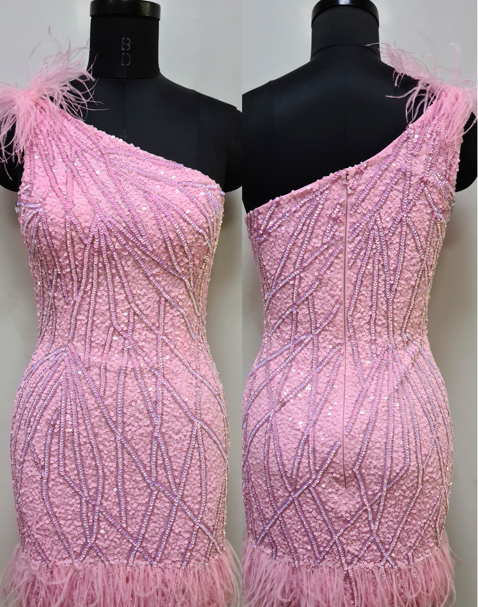 Primavera Couture 4029 One Shoulder Sequin Design Feather Embellishment on Bottom And Shoulder Homecoming Cocktail Dress. This Primavera Couture 4029 dress is impactful with its one shoulder sequin design and feather embellishments. Perfect for a homecoming or cocktail event, it's the perfect combination of glamour and sophistication.
