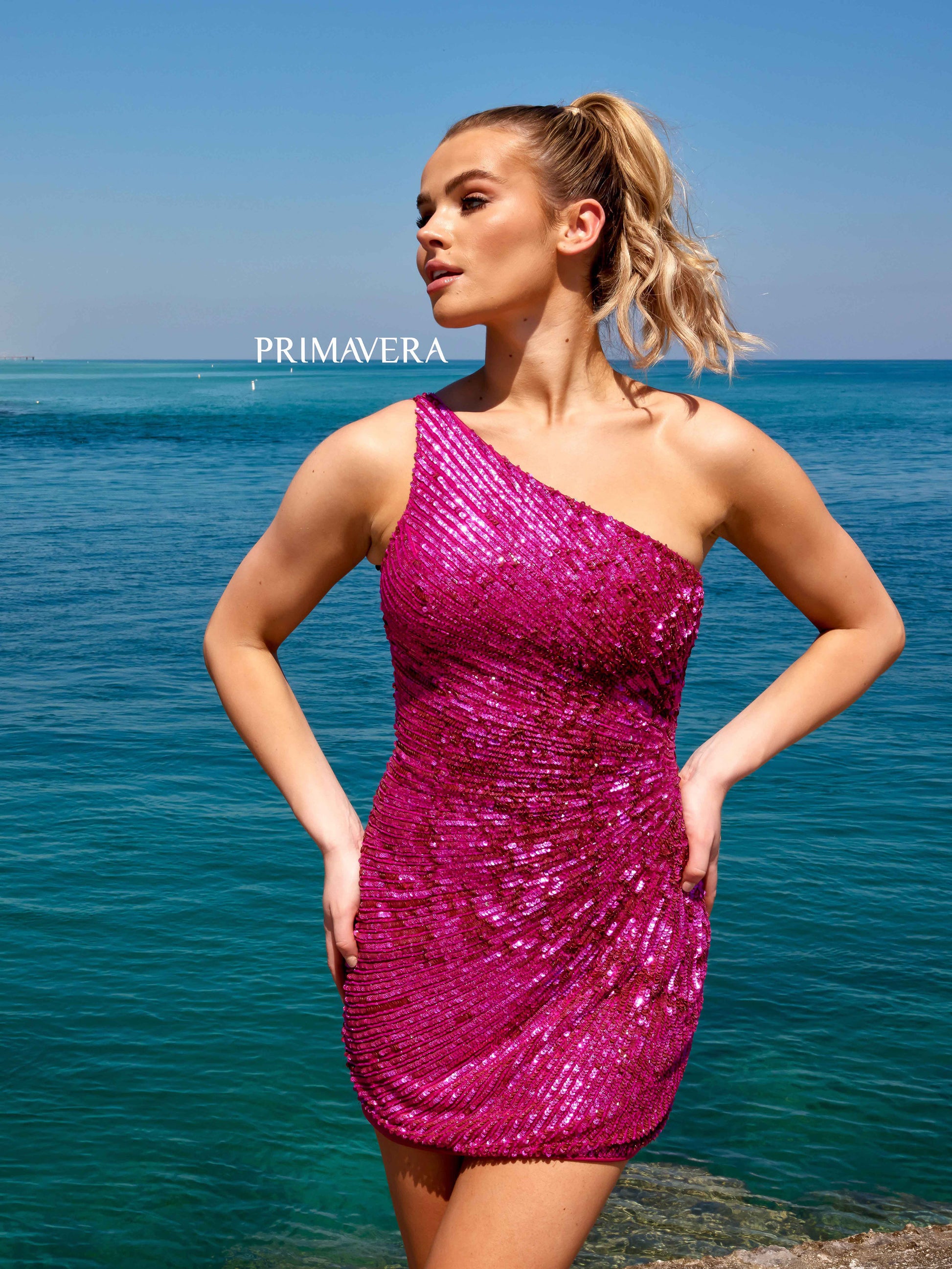 Primavera Couture 4055 Ruched Cocktail Dress Side One Shoulder Sequin And Beaded Line Design Homecoming Dress. This Primavera Couture 4055 Homecoming Dress adds just the right amount of sparkle with a multi-dimensional sequin and beaded line design. The