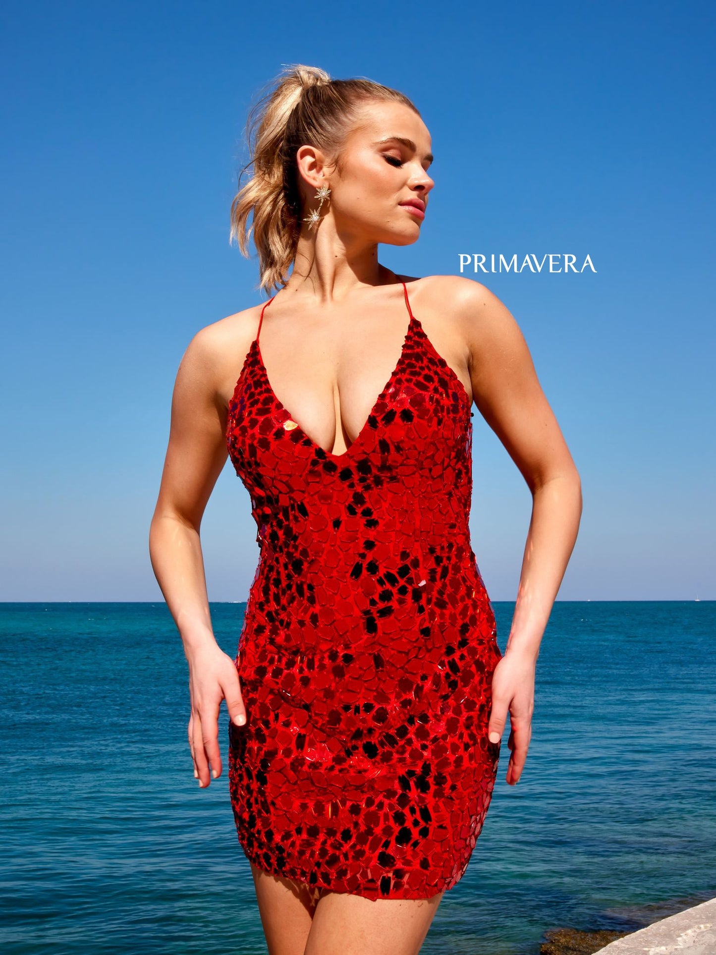 This Primavera Couture 4056 Cut Glass Open Tie Back V-Neck Cocktail Homecoming Dress is crafted with 100% premium fabric for maximum comfort and style. This outstanding design features an open tie back detail, V-neckline and shimmering cut glass embroidered fabric, perfect for making heads turn at a special occasion.   
