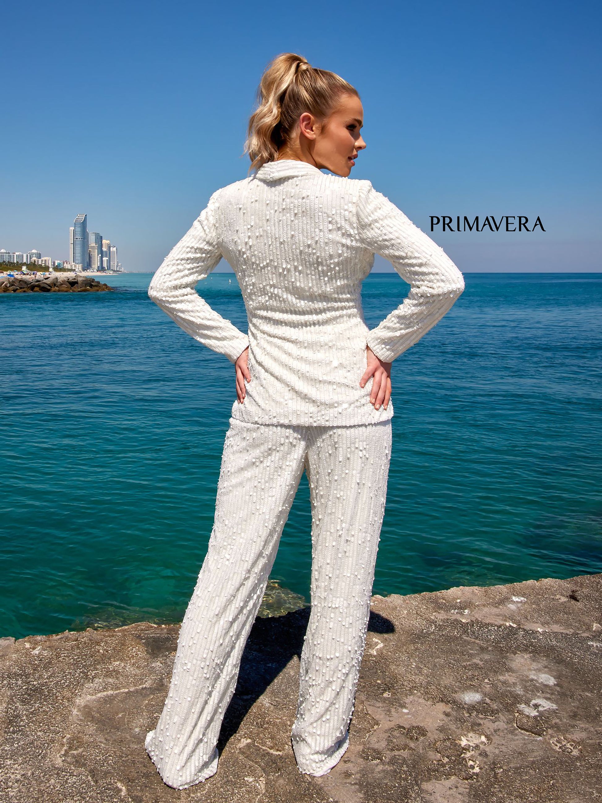 Primavera Couture 4063 Make a statement in the Primavera Couture 4063 Suit. Crafted from 100% sequins, its one-button styling and long pants create a classic look perfect for any occasion. The sequins provide a glossy, eye-catching finish, ensuring you look and feel your best.