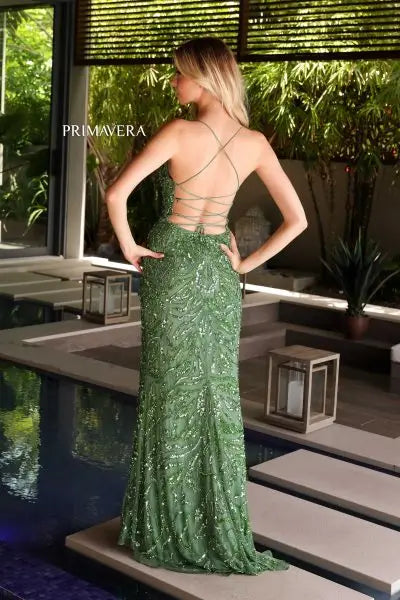 Elevate your look with the Primavera Couture 4107 Long Prom Dress. The corset fitted design accentuates your curves while the high slit adds a touch of drama. Adorned with intricate sequin and bead details, this V-neck formal pageant gown will make you stand out from the rest. Turn heads at your next special occasion.