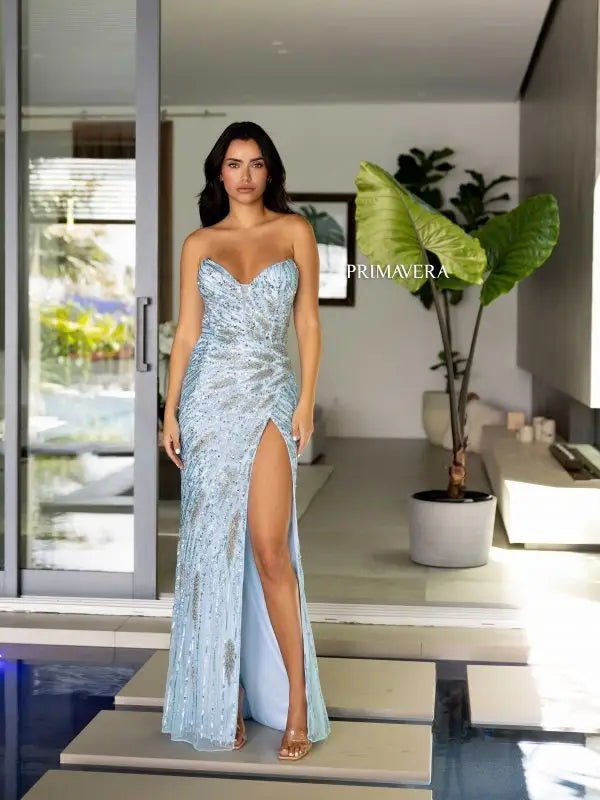 Indulge in elegance with the Primavera Couture 4108 long prom dress. The sequin fitted design features a high slit, strapless sweetheart neckline, and formal pageant gown style. You'll shine at any event in this glamorous and flattering gown.