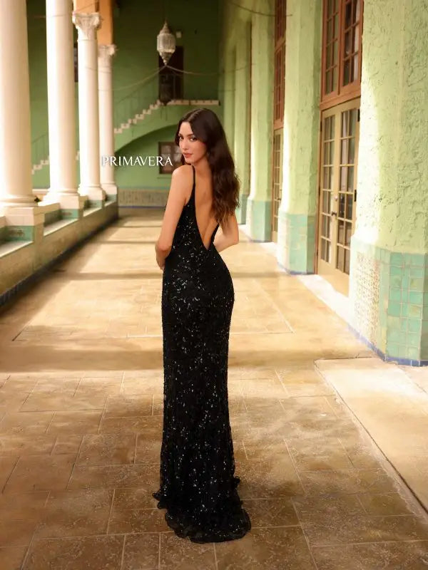 Elevate your formal attire with the Primavera Couture 4115 Long Prom Dress. This stunning gown features a fitted silhouette, high slit, and V-neckline for a sultry yet elegant look. Adorned with sparkling sequins and an open low back, this dress is perfect for prom, pageants, or any special occasion.