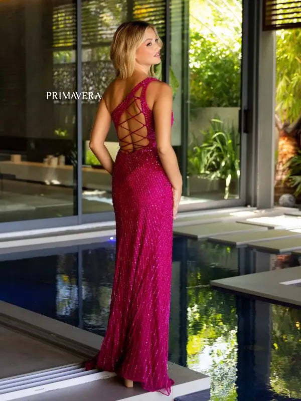 Elevate your prom or pageant look with the Primavera Couture 4120 dress. Featuring intricate beadwork and sequins, this one shoulder gown has a strappy back and a high slit for a touch of glamour. Its fitted silhouette will flatter your figure, making you feel confident and stylish all night long.