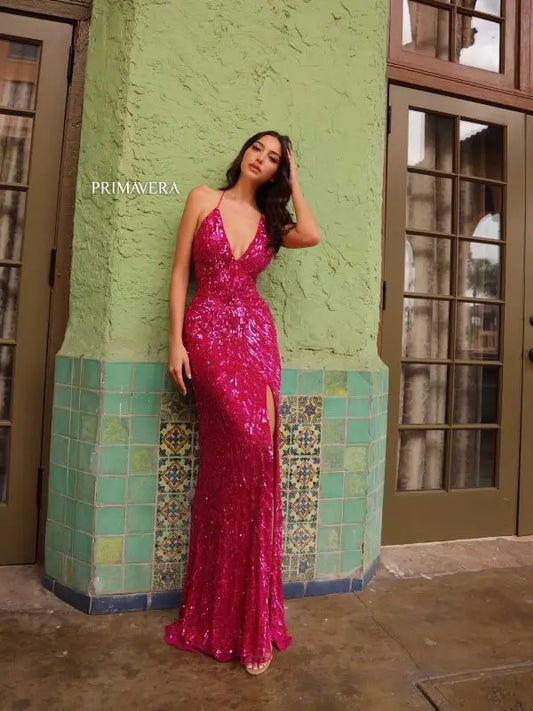 This Primavera Couture 4121 Long Prom Dress is designed with a corset and plunging neckline for a flattering and alluring fit. The high slit adds a touch of daring elegance, while the sequin embellishments provide a glamorous look. Perfect for prom, pageants, or any formal event.