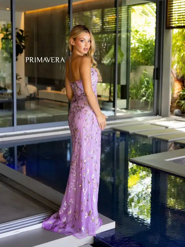 Be the belle of the ball with Primavera Couture's 4123 Long Prom Dress. With a sweetheart neckline and strapless design, this gown is adorned with intricate beadwork and a stunning floral pattern. The fitted silhouette and high slit add a touch of glamour to this formal pageant gown.