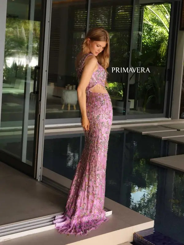 Make a lasting impression in the Primavera Couture 4131 Long Prom Dress. This stunning gown features intricate beading and a beautiful floral design, along with side cut outs and fitted fringes for a flattering silhouette. Perfect for formal events or pageants, this gown is sure to make you stand out with its elegant and unique details.