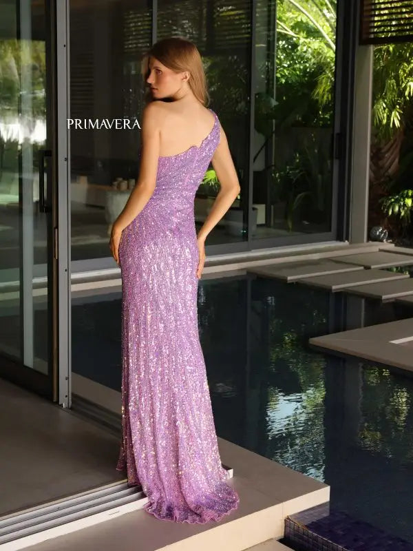 Impress the judges in the Primavera Couture 4133 formal pageant gown. With its asymmetrical neckline and sequin detailing, this dress exudes elegance. The high side slit adds a touch of sophistication, while the back design adds a modern twist. Perfect for making a statement and standing out on stage.