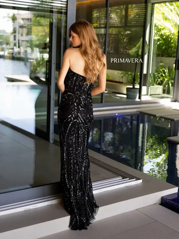 Expertly designed by Primavera Couture, the 4134 Long Prom Dress combines a sequined, fitted silhouette with a high slit and strapless design for a formal, pageant-worthy look. Stand out from the crowd with this elegant gown, perfect for a glamorous night out or special occasion.