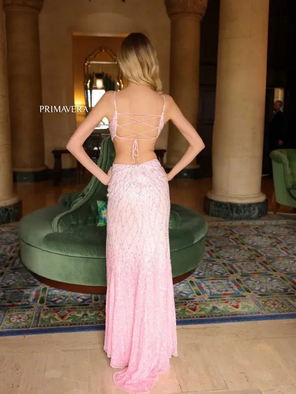 This Primavera Couture 4136 prom dress offers a stunning look with its cutout corset bodice, backless design, and ombre beaded skirt. Intricately sequined and with a daring thigh-high slit, this gown is sure to turn heads. Ideal for any special occasion.  Sizes: 000-18  Colors: Pink, Lilac, Black