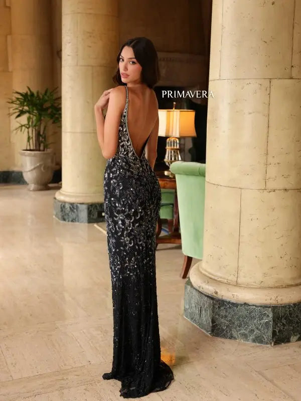 Flaunt your figure in the Primavera Couture 4150 Long Prom Dress. The beaded sequin detailing on this fitted gown adds a touch of glamour, while the high slit and open back provide a sexy yet elegant look. Perfect for any formal event, this gown will make you the center of attention.