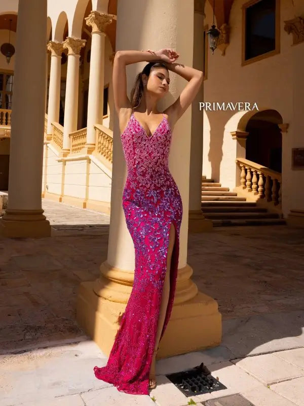 Flaunt your figure in the Primavera Couture 4150 Long Prom Dress. The beaded sequin detailing on this fitted gown adds a touch of glamour, while the high slit and open back provide a sexy yet elegant look. Perfect for any formal event, this gown will make you the center of attention.