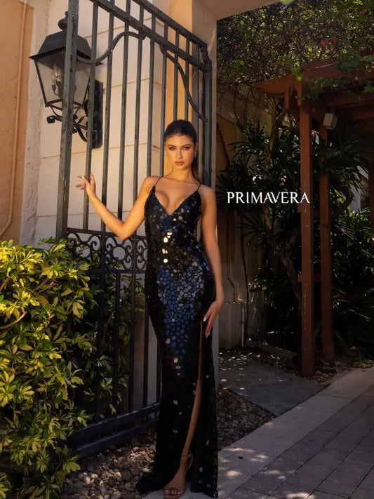 Elevate your elegant and refined style with the Primavera Couture 4151 Long Prom Dress. The fitted silhouette, glass cut beads, and V-neckline create a dazzling effect, while the lace-up back provides the perfect fit. Perfect for prom, pageants, or any formal event, this gown is both glamorous and sophisticated.