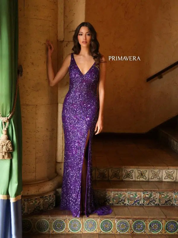 Elevate your fashion game with the stunning Primavera Couture 4153 Long Prom Dress. The elegant V-neck and high slit add a touch of sophistication, while the open back and sequin details make a bold statement. Perfect for formal events and pageants, this fitted gown will make you stand out from the crowd.