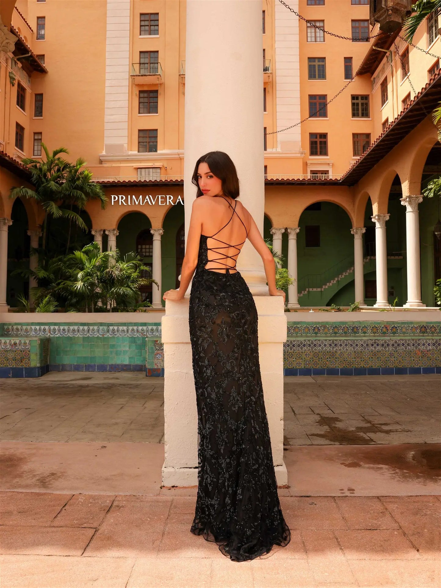 Step into the spotlight in the Primavera Couture 4161 Prom Dress. With dazzling sequin details and a figure-flattering fit, this dress is sure to turn heads. The high slit adds a touch of drama, while the lace-up back adds an extra element of style. Perfect for any formal event.