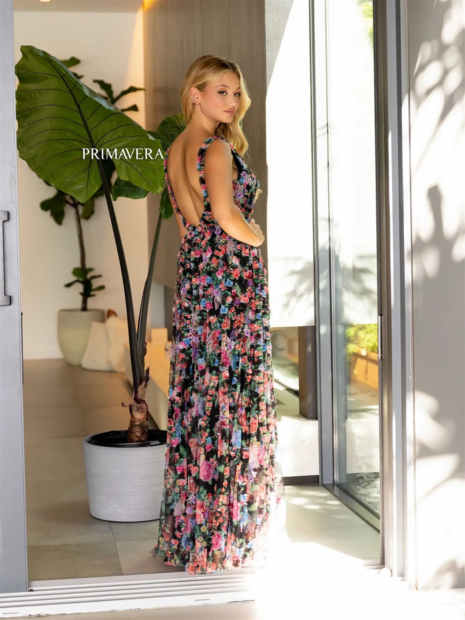 Elevate your style with the stunning Primavera Couture 4167 Long Prom Dress. This floral print gown features intricate beading, a fitted body, and a high slit for a glamorous and sophisticated look. Stand out at any formal event with this elegant and eye-catching dress.