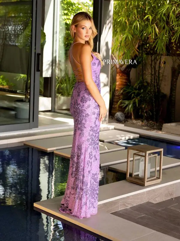 Exude elegance in the Primavera Couture 4168 Long Prom Dress. This fitted gown features stunning sequin and bead detailing, a lace-up back, and a high slit for added glamour. Perfect for formal events and pageants, this dress will make you stand out with its sophisticated and stylish design.