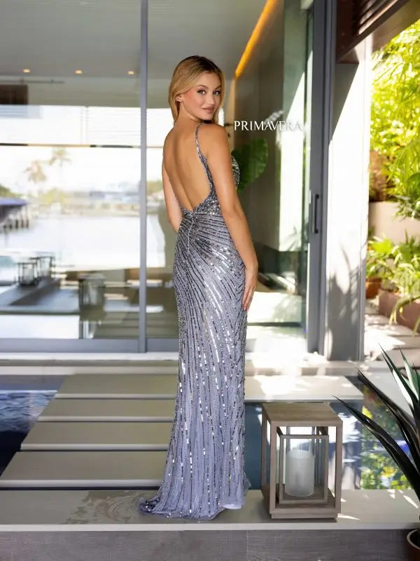 Elevate your formal attire with the Primavera Couture 4171 Long Prom Dress. The fitted silhouette and plunging V neckline highlight your curves, while the high slit adds a touch of alluring elegance. Adorned with shimmering sequins, this dress is perfect for any formal occasion.