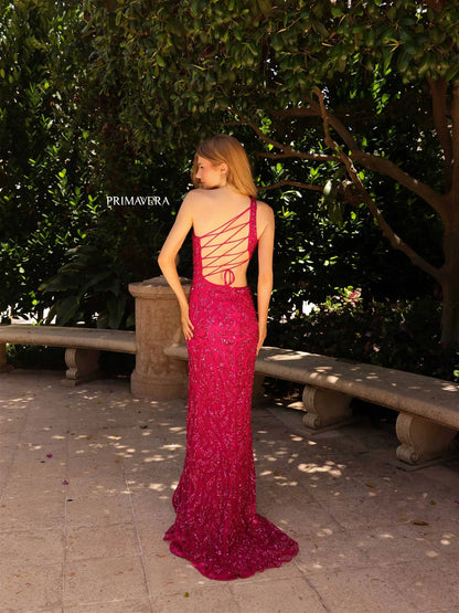 The Primavera Couture 4191 prom dress is a dazzling statement piece. Crafted from sequins and beading, its fitted body, asymmetrical neckline, and side-cutouts flatter any figure. The backless style features an open back with corset lacing, and a high side slit to make a grand entrance. Perfect for special occasions.  Sizes: 000-24  Colors: Gold, Fuchsia, Sage Green, Crystal Blue