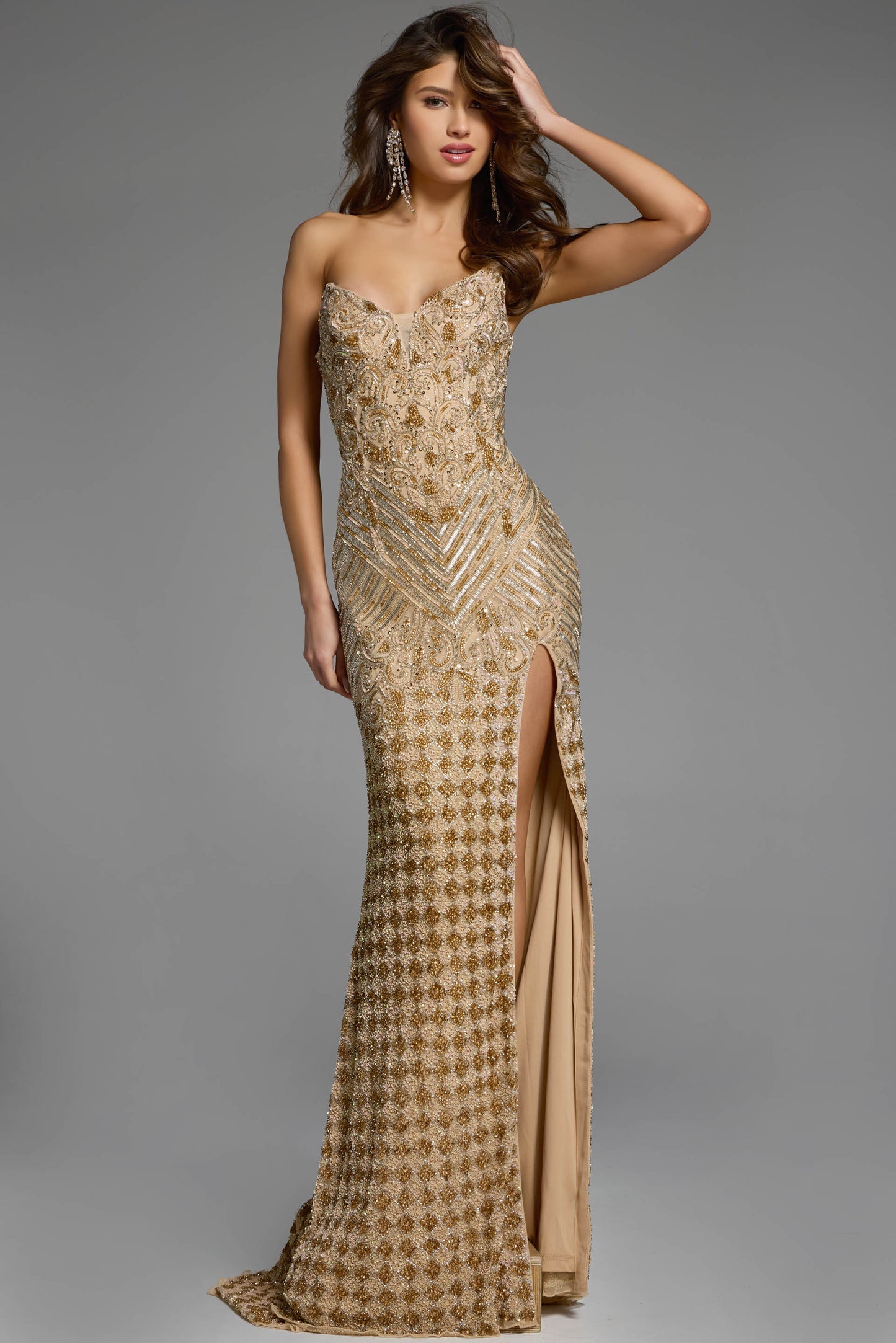 Introducing the Jovani 42412, a long, flowing formal pageant dress with a playful slit, beaded accents, and eye-catching V-neck. This gown is perfect for making an elegant entrance, while still showing off your fun and quirky style. With a stunning peak point train, you're sure to turn heads at any event. Strapless Sparkling Beaded Gown 42412 exudes elegance and regality, perfect for making a dazzling entrance at any special event. This floor-length gown features a high slit, adding a touch of allure and so