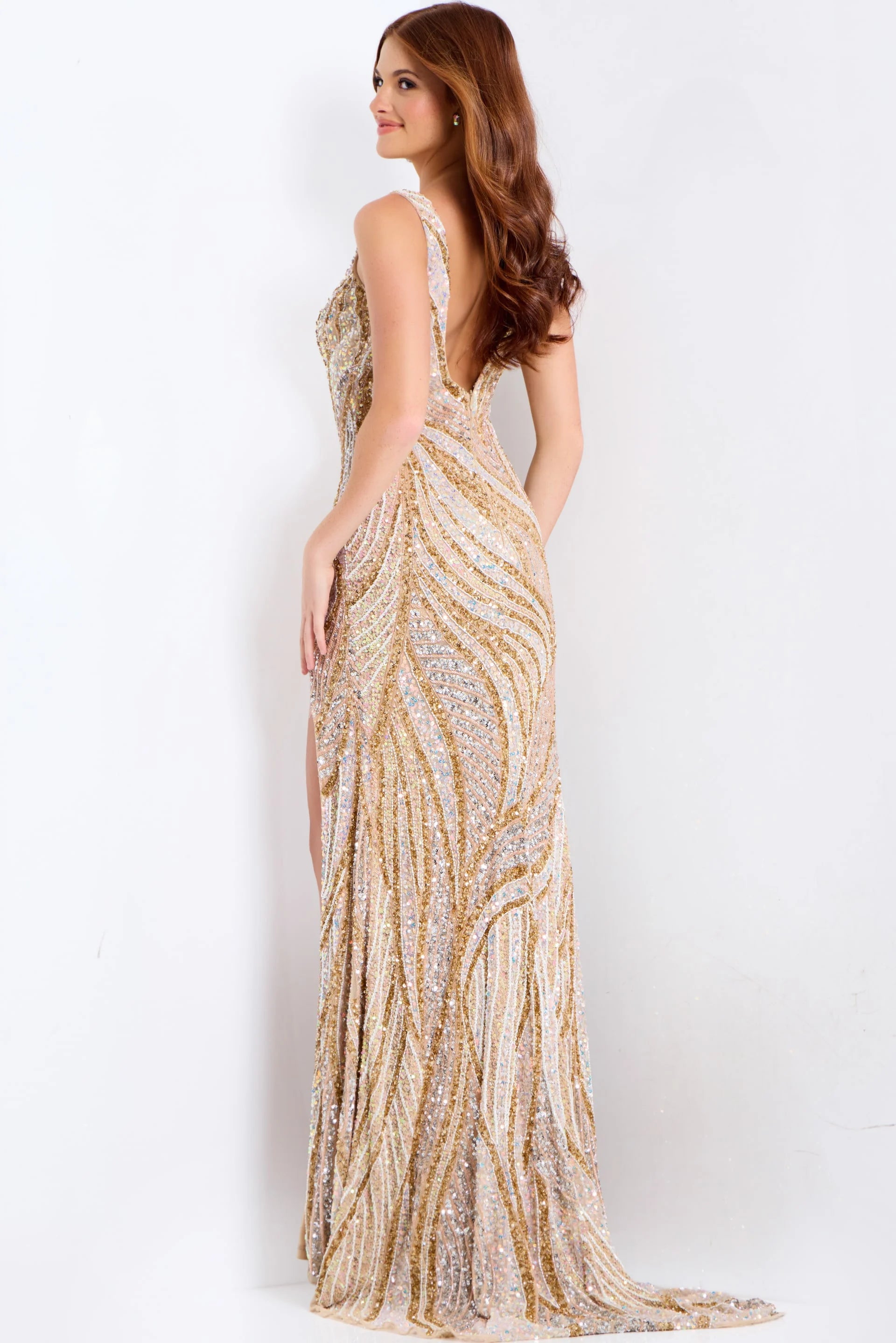 Make a statement at your special event with the Jovani 42512 Long Beaded Sequin Prom Dress. This beautiful gown features a stunning v-neckline, intricate beaded sequin detailing, and a sexy open back with a high leg slit. The mermaid silhouette will flatter your curves and make you feel confident all night long. Perfect for prom, pageants, or any formal occasion. This exquisite gown features a floor-length silhouette adorned with shimmering sequins throughout. A daring high slit accentuates the design, prov