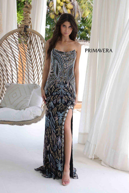 Elevate your style in this Primavera Couture 4331 Long Beaded Prom Dress. The intricate beading and corset detailing will accentuate your figure, while the strapless neckline adds a touch of elegance. The slit and formal evening gown design make this dress perfect for any special occasion.