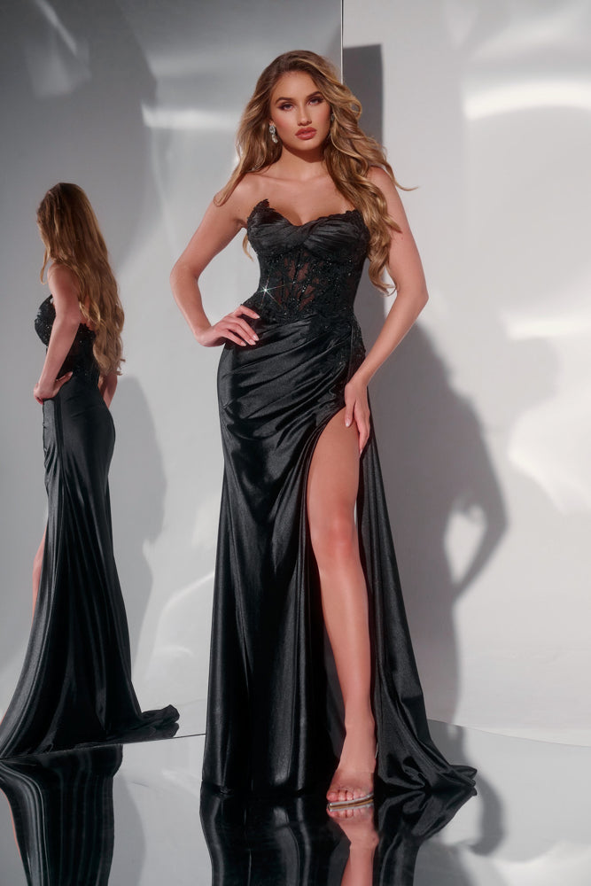 Elevate your evening in the Jovani 43848 Long Satin Sheer Lace Corset Prom Dress. This breathtaking gown features a satin sheen, sheer lace corset, and a slit overskirt for a dramatic and elegant silhouette. Make a statement in this luxurious and exclusive dress. Elegant strapless gown showcases a dramatic sweetheart neckline, perfect for adding a touch of romance to your evening look. The fitted lace bodice is beautifully embellished, drawing attention to intricate details that accentuate the natural curve