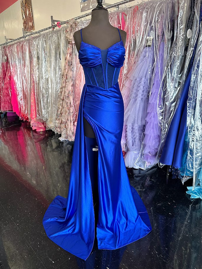 Elevate your evening with the Nina Canacci 4409, a size 4 royal long satin gown featuring a sheer corset bodice that contours elegantly. This sophisticated prom dress showcases a plunging neckline and a dramatic slit overskirt, blending classic glamour with modern allure—perfect for pageants or formal occasions.

Size: 4&nbsp;

Color: Royal