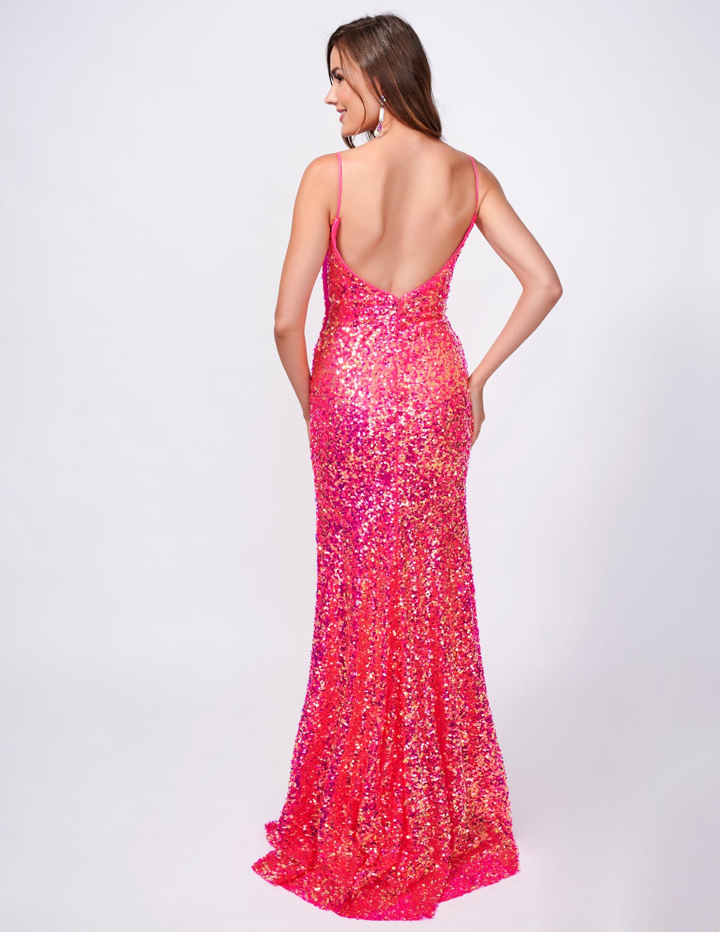 This fitted sequin long prom dress by Nina Canacci 4410 is designed to make you stand out on the dance floor. With a low back and V neck, this elegant gown features a stylish slit that will add an extra touch of sophistication to your look. Perfect for any formal occasion, this dress is sure to make you feel confident and glamorous.