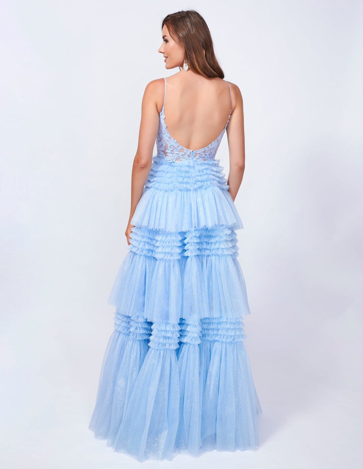 Elevate your prom night with the Nina Canacci 4418 Sheer Lace Corset Prom Dress. Its layered A-line design, shimmering tulle fabric, and delicate lace corset create a stunning, formal ball gown silhouette. Enjoy the perfect blend of elegance and glamour with this timeless dress.