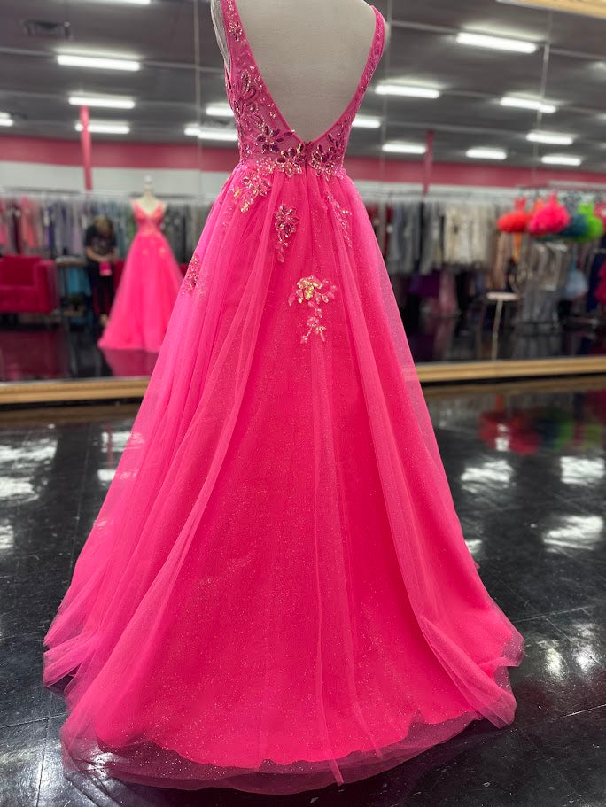 This Nina Canacci 4427 ballgown in size 4 showcases exquisite sequin lace detailing over a sheer bodice, creating a refined and elegant look. The flattering V-neckline and classic A-line silhouette enhance your figure while offering graceful movement. Perfect for prom or formal events, this gown combines timeless sophistication with subtle sparkle for a memorable evening.

Size: 4

Color: Fuchsia