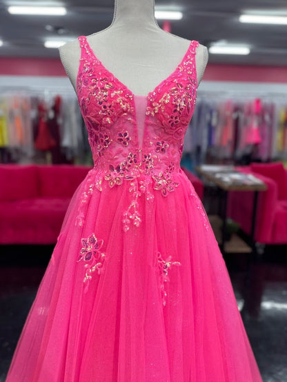 This Nina Canacci 4427 ballgown in size 4 showcases exquisite sequin lace detailing over a sheer bodice, creating a refined and elegant look. The flattering V-neckline and classic A-line silhouette enhance your figure while offering graceful movement. Perfect for prom or formal events, this gown combines timeless sophistication with subtle sparkle for a memorable evening.

Size: 4

Color: Fuchsia
