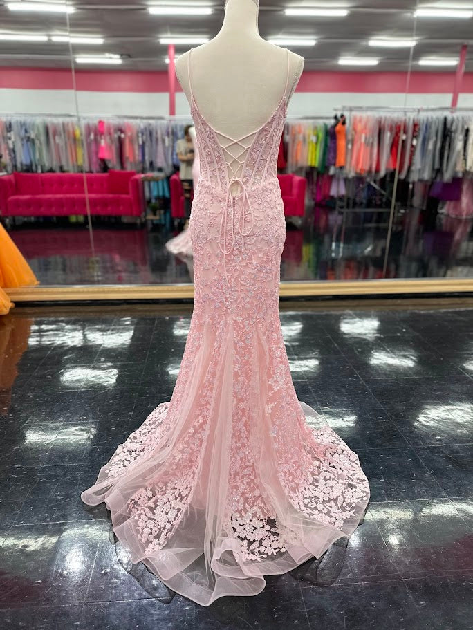 Elevate your formal occasion with the Nina Canacci 4434 gown, designed in a delicate peach hue. This size 4 mermaid dress features a sheer lace corset bodice adorned with subtle sequins, creating an elegant shimmer. The flattering V-neckline enhances your silhouette, while the fitted mermaid skirt offers a graceful, sophisticated finish perfect for prom or any special event.

Size: 4

Color: Peach