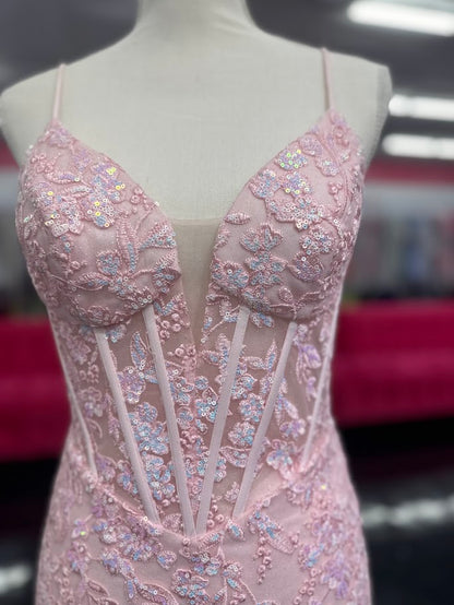 Elevate your formal occasion with the Nina Canacci 4434 gown, designed in a delicate peach hue. This size 4 mermaid dress features a sheer lace corset bodice adorned with subtle sequins, creating an elegant shimmer. The flattering V-neckline enhances your silhouette, while the fitted mermaid skirt offers a graceful, sophisticated finish perfect for prom or any special event.

Size: 4

Color: Peach